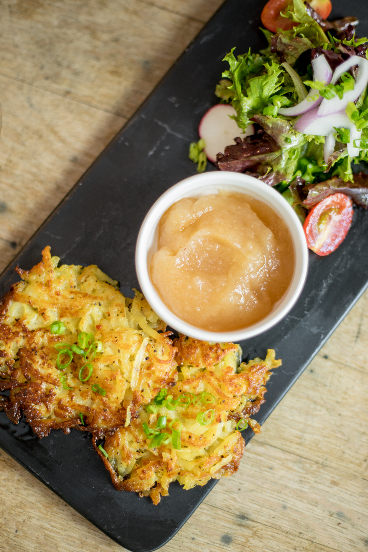 Kartoffelpuffer with applesauce and salad at Nick’s German Kitchen